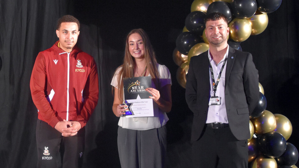 Faye Oxley receiving her awards from Lewis Richards (left) and Nicky Betteridge from Bradford College