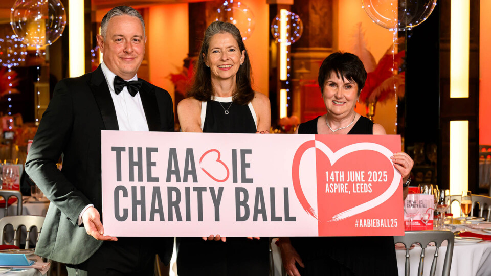 Holding sign: James Hunt, Emma Lancaster and Sheena Anderson