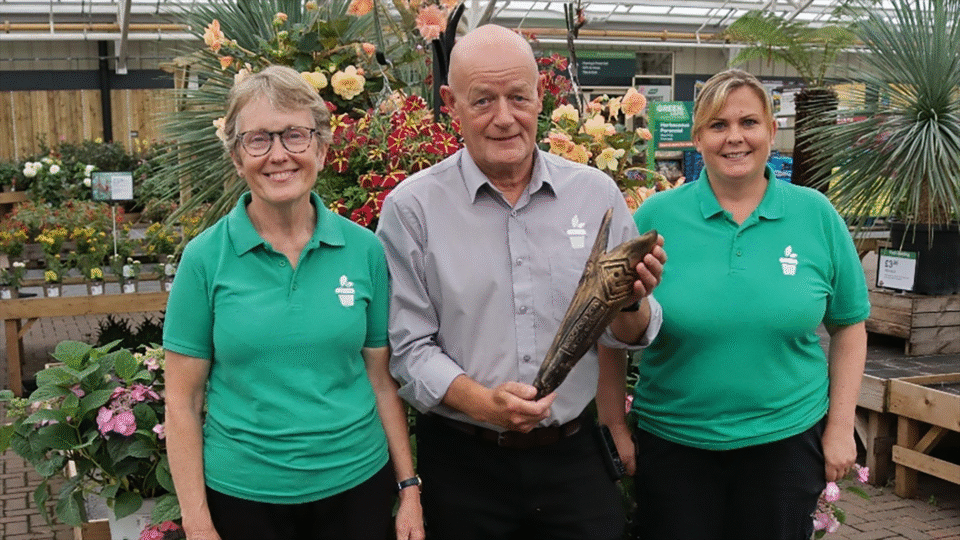 Angela Shaw Joe Appleyard and Katie Tempest with the Baton of Cohesion at Tong Garden Centre