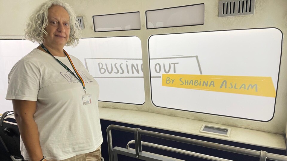 Dr Shabina Aslam aboard the Bussing Out immersive arts installation of the top deck of a 1970s bus. Images credit: University of Bradford