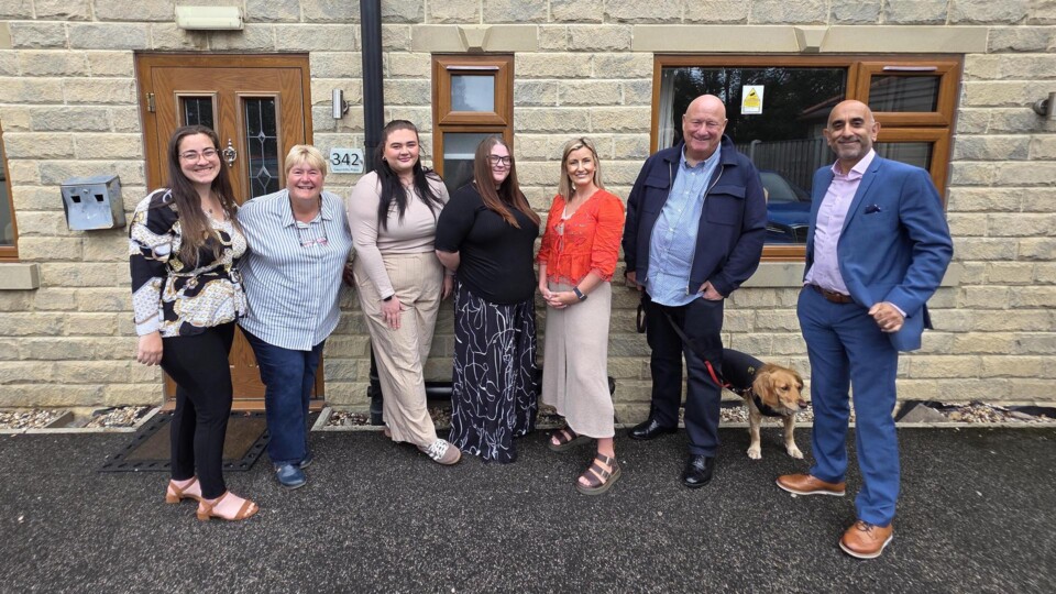 HAND OVER: Debbie and Mark Clough of The Sanctuary Project in Wakefield have transferred the business to an Employee Ownership Trust. Debbie, second left, and Mark, second right, are picture with some of their team and Azets Corporate Finance Partner Tariq Javaid, who advised on the transaction