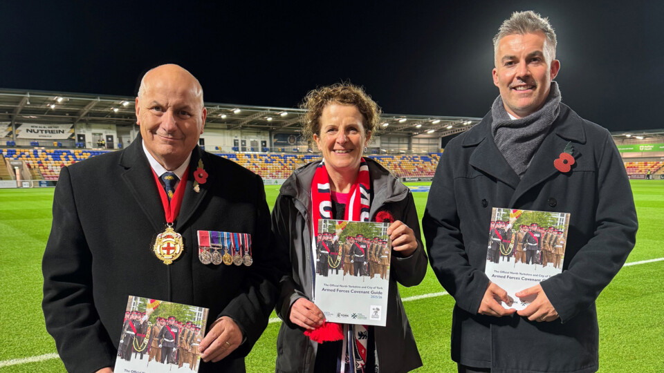 At York's LNER Community Stadium ahead of the 11November Remembrance Day match of York FC vs Rochdale, and holding copies of the new guide are, left to right: The Lord Mayor Cllr Martin Rowley; Cllr Claire Douglas, Leader of City of York Council, and David Skaith, Mayor of the York and North Yorkshire Combined Authority.