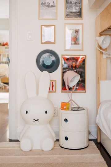 Children’s bedroom designed by Roberts Renovations through their remote interior design service, featuring playful décor, framed artwork, and a modern bedside setup.