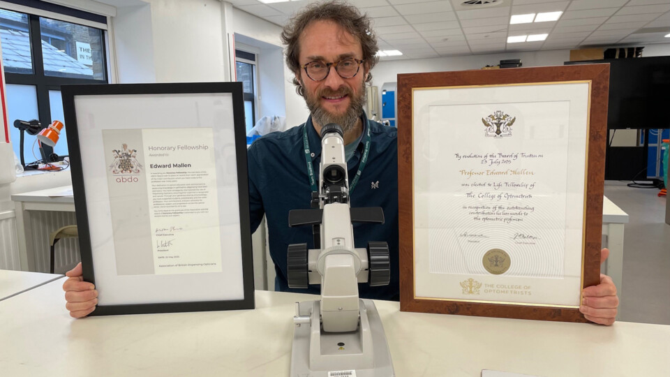Professor Edward Mallen with his certificates on his Life Fellowship of the College of Optometrists and made an Honorary Fellow of the Association of British Dispensing Opticians (ABDO). Images credit: University of Bradford