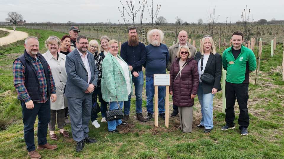 Some of City of York Council's foster carers, together with representatives from the council's Children's Services team and Forestry England next to the new plaque.