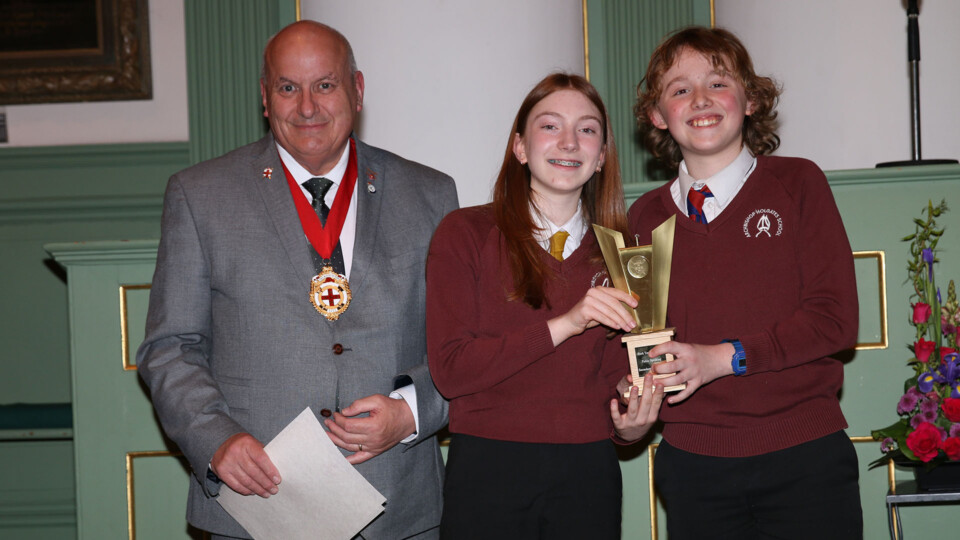 The Rt Hon Lord Mayor of York, Councillor Martin Rowley BEM, presenting Destiny and Milo from Archbishop Holgate’s School with the winning trophy.