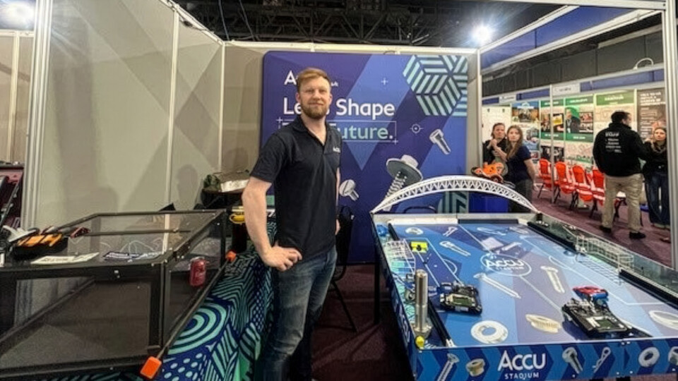 Patrick Faulkner with robotic football game Firefly Upscaler 4x scale